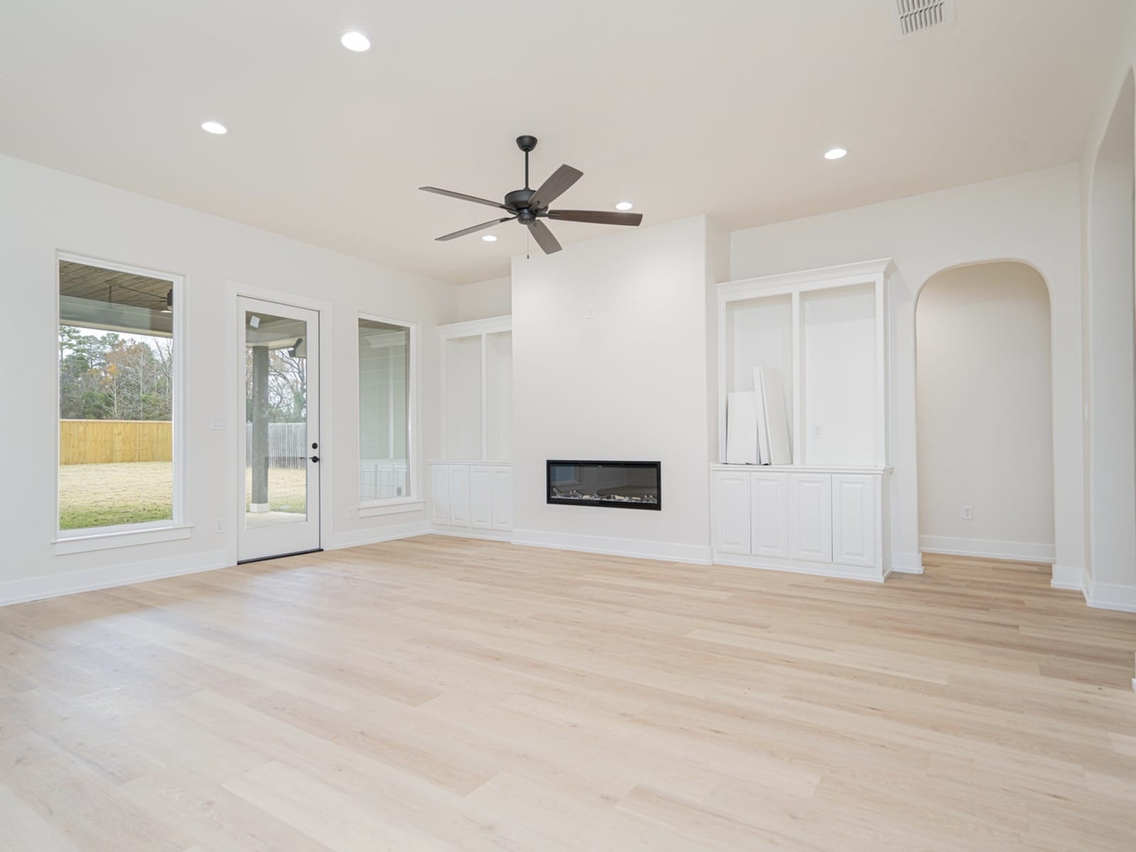 living-room-with-large-windows-and-ceiling-fan-tyler-home-addition-specialist